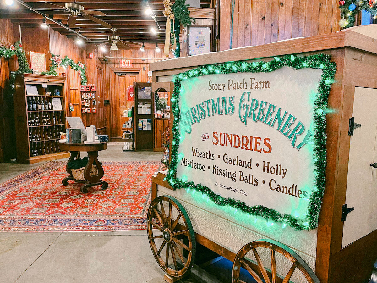 A festive shop interior featuring a cart with a sign reading 